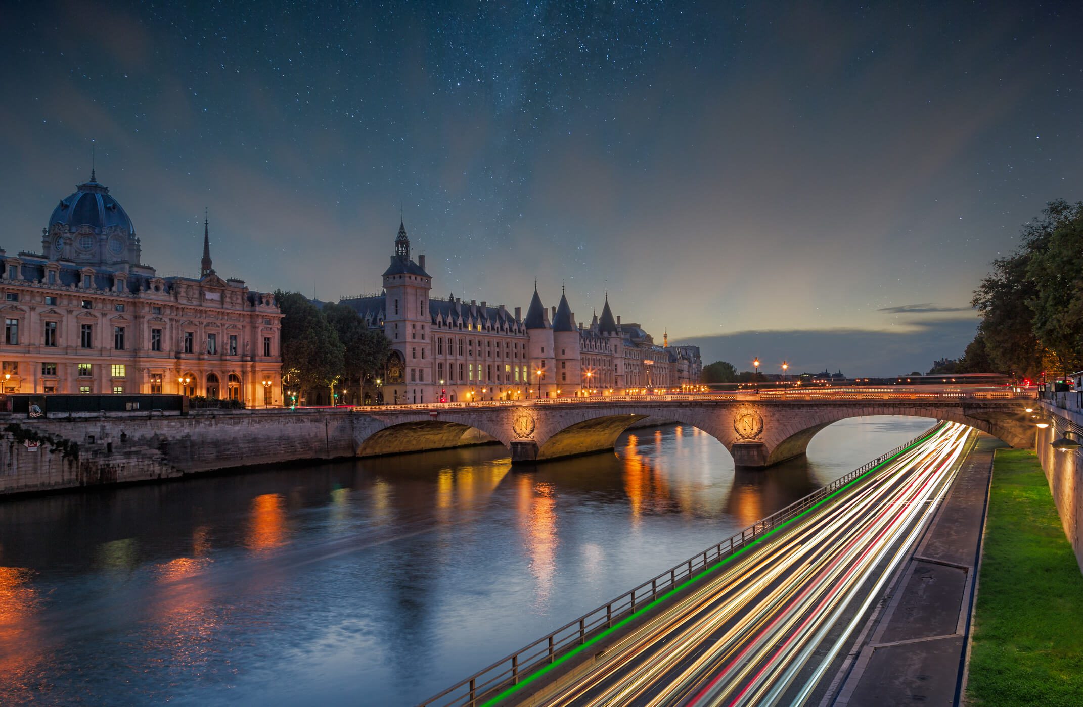 Paris bridge at night with light trails